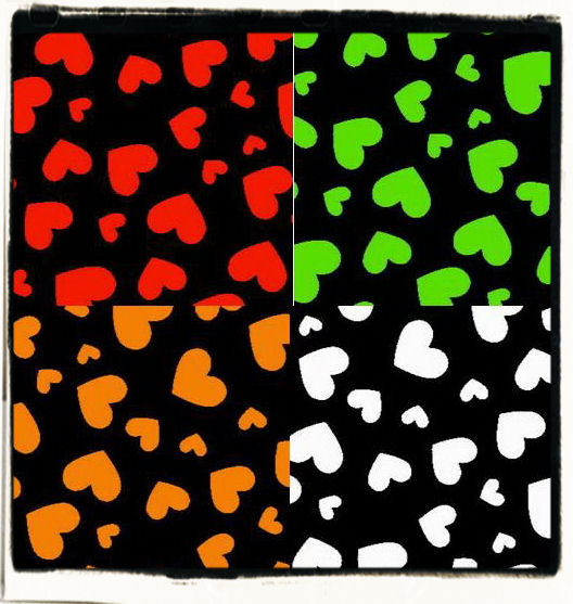 Brightly coloured hearts on a blackground printable papers for free download.