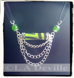Lime and black paper bead pendant with chains.